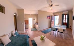 a living room with a couch and a table at Themelina Studios in Emborios