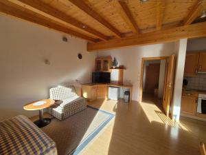 a living room with a couch and a table at Haus Gande in Spiss