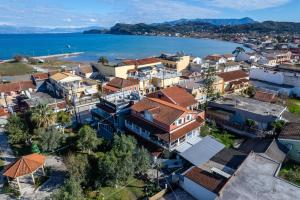an aerial view of a town next to the ocean at Zoe House in Sidari