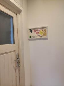 a door to a room with a sign on the wall at Eider in Karolinenkoog