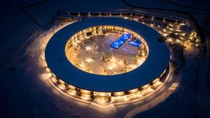 an overhead view of a stage with lights at night at OLM Nature Escape - Eco Aparthotel in Campo Tures