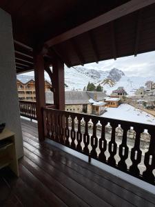 a balcony with a view of a snow covered mountain at "1-2-3 SOLEIL" Duplex - 8 pers - La Mongie Pic d'espade in La Mongie