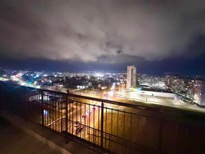 a view of a city at night with lights at Vyara apartments 56 in Varna City