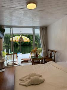 a bedroom with a bed and a view of the water at Erawan Mountain Beach & Maya Erawan & Goodview Erawan in Tha Kradan +232 photos