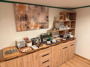 a kitchen with a counter with food on it at Gästehaus Posch in Krimml