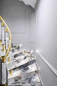 a set of stairs in a room with silver walls at Kilic Boutique Hotel in Istanbul +38 photos