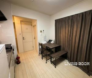 a kitchen with a desk and a living room at MEME Villa 5BR - 3 Separate Toilets & 3 Showers - 10Gbps Wifi in Tokyo