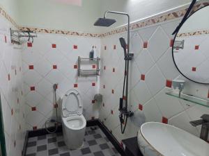 a bathroom with a toilet and a sink at THHomestay in Danang +17 photos