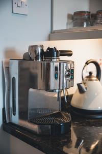 a coffee maker sitting on top of a counter at West Gallaton Farmhouse in Stonehaven