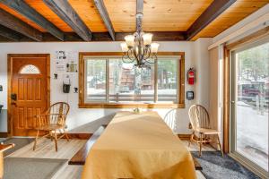 a dining room with a table and chairs and a window at Discount Available! Lake Tahoe Gem w/ Pool Table in South Lake Tahoe