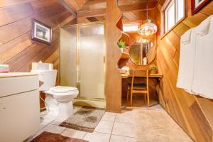 a bathroom with a toilet and a sink and a mirror at Discount Available! Lake Tahoe Gem w/ Pool Table in South Lake Tahoe +31 photos