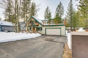 a house with a garage in the snow at Discount Available! Lake Tahoe Gem w/ Pool Table in South Lake Tahoe