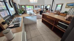 an aerial view of a kitchen and living room at Arch Cabins Self Catering Homes Storms River in Stormsrivier