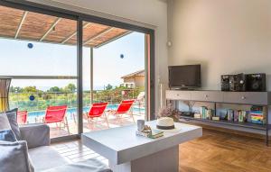 a living room with a view of a pool at Villa Giorgio by Villa Select in Kefallonia