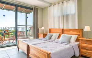 a bedroom with two beds and a balcony at Villa Giorgio by Villa Select in Kefallonia