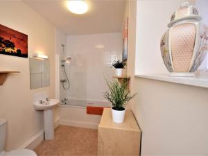 a bathroom with a toilet and a sink and a shower at 5 Bed in Alnwick oc-60497 in Alnwick +21 photos