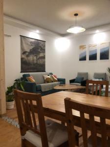 a living room with a couch and a table at Renovated charming appartment in Strasbourg