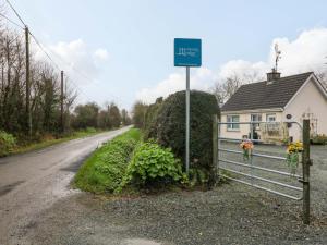 a street sign on the side of a road at Long Jack's in Ballygarrett