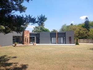 a house with a large yard in front of it at Donido's Place in Alberton +59 photos