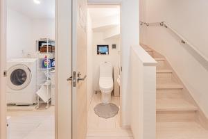a bathroom with a toilet and a washing machine at 春日居 Kasuga House in Tokyo +29 photos