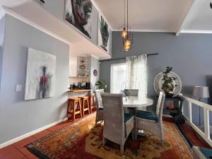a kitchen and dining room with a table and chairs at Derby in Lakeside