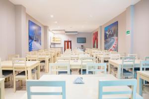 a dining room with white tables and chairs at Ribai Hotels -Riohacha in Ríohacha
