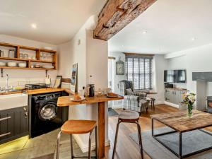 a kitchen and living room with a table and chairs at 1 Bed in Kendal oc-94210 in Kendal