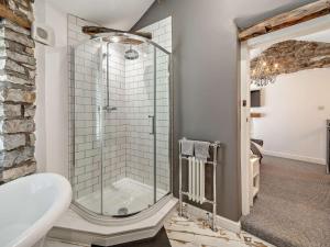 a bathroom with a shower and a sink at 1 Bed in Kendal oc-94210 in Kendal +13 photos