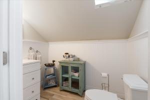 a bathroom with a toilet and a sink at Eagle's Landing Private Dock Dog Friendly in Acton