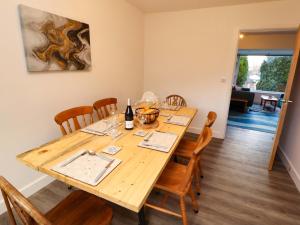 a dining room with a wooden table and chairs at Westerlodge in Keswick