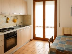 a kitchen with a sink and a stove at Dimora del Golfo in Soverato Marina