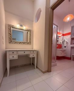 a bathroom with a mirror and a sink at B&B Sud Est in Carmiano +33 photos