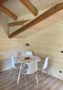 a wooden dining room with a table and chairs at Le Moline b&b in Masserano