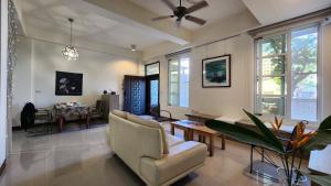 a living room with a couch and a table at Dongle B&B in Taitung City