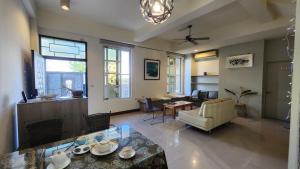 a living room with a table and chairs at Dongle B&B in Taitung City