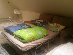 a bed with two pillows on it in a room at Ormåsen Loft in Ormåsen