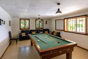 a living room with a pool table in it at Catalunya Casas Nature and Tranquility for 24 pax - 30km to beach in Sant Pere de Vilamajor