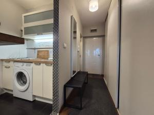 a laundry room with a washer and dryer at Apartment Madera in Belgrade