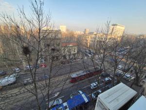 a view of a city with buses and parked cars at Apartment Madera in Belgrade