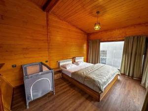 a bedroom with a bed in a wooden room at Chopan Resort Aparan in Aparan +31 photos