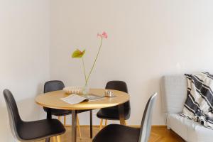 a room with a table and chairs and a couch at Quiet Kraków Nest by Siemaszki 41 in Krakow +5 photos