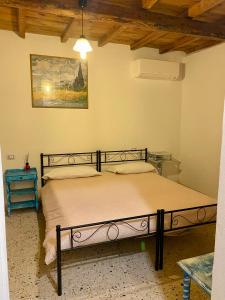 a bedroom with a large bed in a room at Locanda Al Cavaliere in Molinella