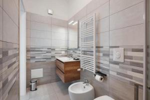 a white bathroom with a sink and a toilet at GRIMALDI ROOMS Costa d'Amalfi in Pagani +19 photos