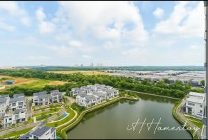 an aerial view of houses and a river at Retro Game - D'Lagoon Sri Austin By iH Home in Kempas