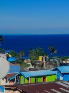 a view of a city with the ocean in the background at Golden View Hotel in Port Blair