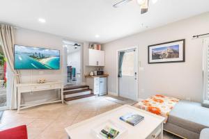 a living room with a couch and a table at Shady Banks Oasis in Fort Lauderdale