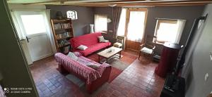 an overhead view of a living room with a red couch at Gîte de la Gagée in Besmont