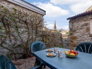 a blue table with a bowl of fruit on it at 2 Bed in Bakewell oc-pk894 in Bakewell