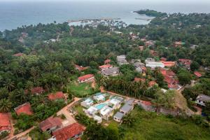 an aerial view of a house with a resort at Chaparrals Surf in Dickwella