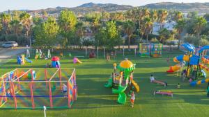 a park with many different types of playground equipment at Vascellero Club Resort in Cariati